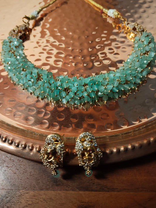 Sea Green Cubic Zirconia Cluster Lord Ganesha Matte Finish Necklace Set