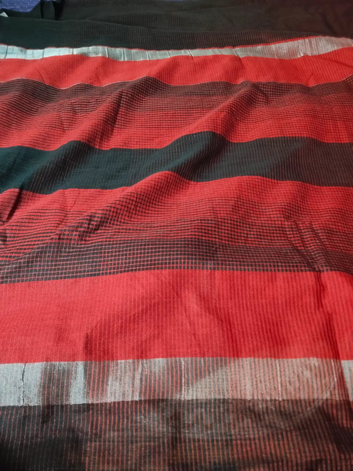 Pallu of Black & Red Linen Blend Striped Saree