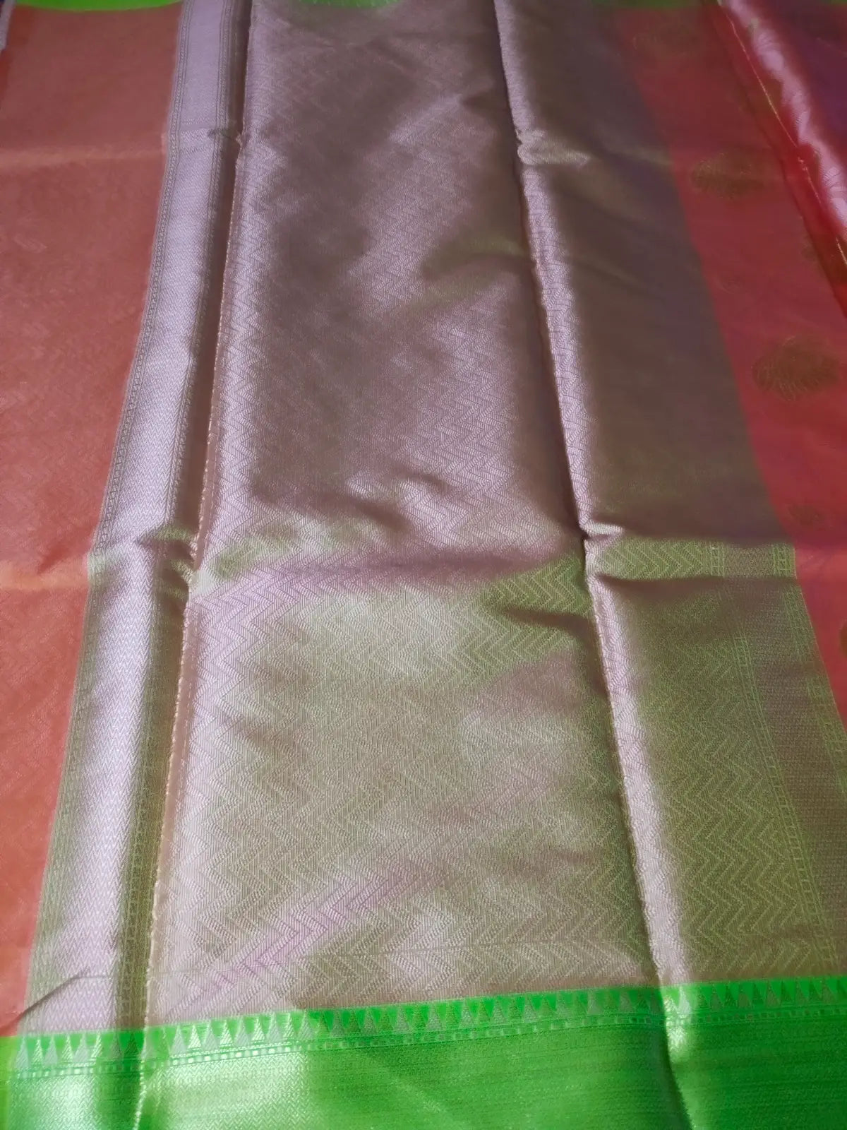 Pallu of Peach Kora Muslin Saree with Jaal Design & Floral Border