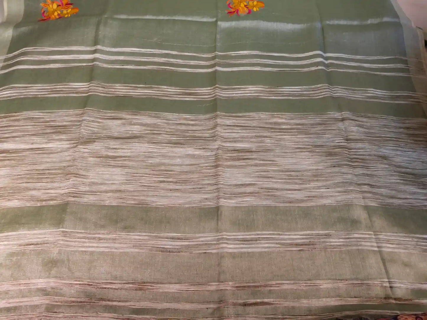 Pallu of Pastel Green Embroidered Zari Linen Saree