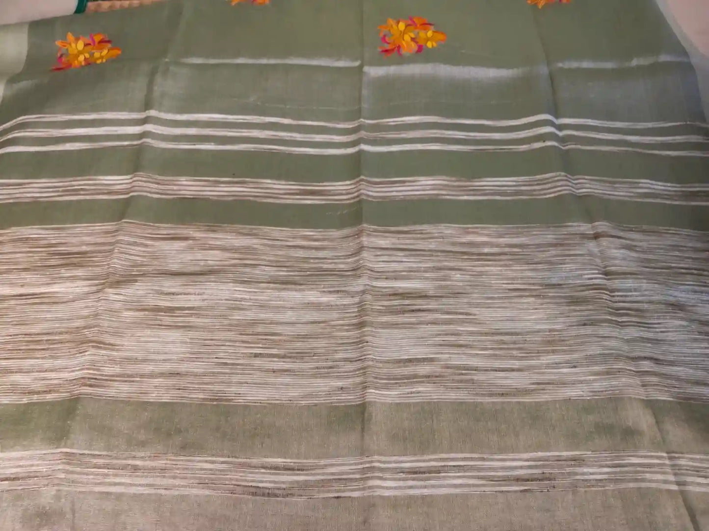 Pallu of Pastel Green Embroidered Zari Linen Saree